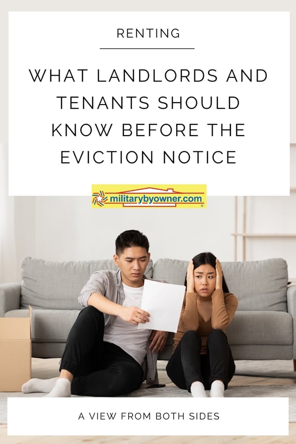 Distressed couple sits on floor against gray couch and looks at paper. Woman has hands on head and there are moving boxes stacked on the floor around them with text, What Landlords and Tenants Should Know Before the Eviction Notice-2