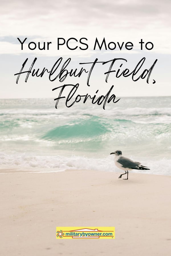 Bird walking across Destin Beach, Florida with small wave of emerald green water rushing ashore and text, Your PCS Move to Hurlburt Field, Florida