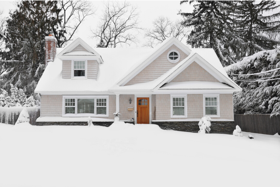 Home with snow and snowy yard