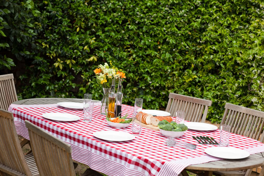 updated table and linens make the most of your backyard space. 