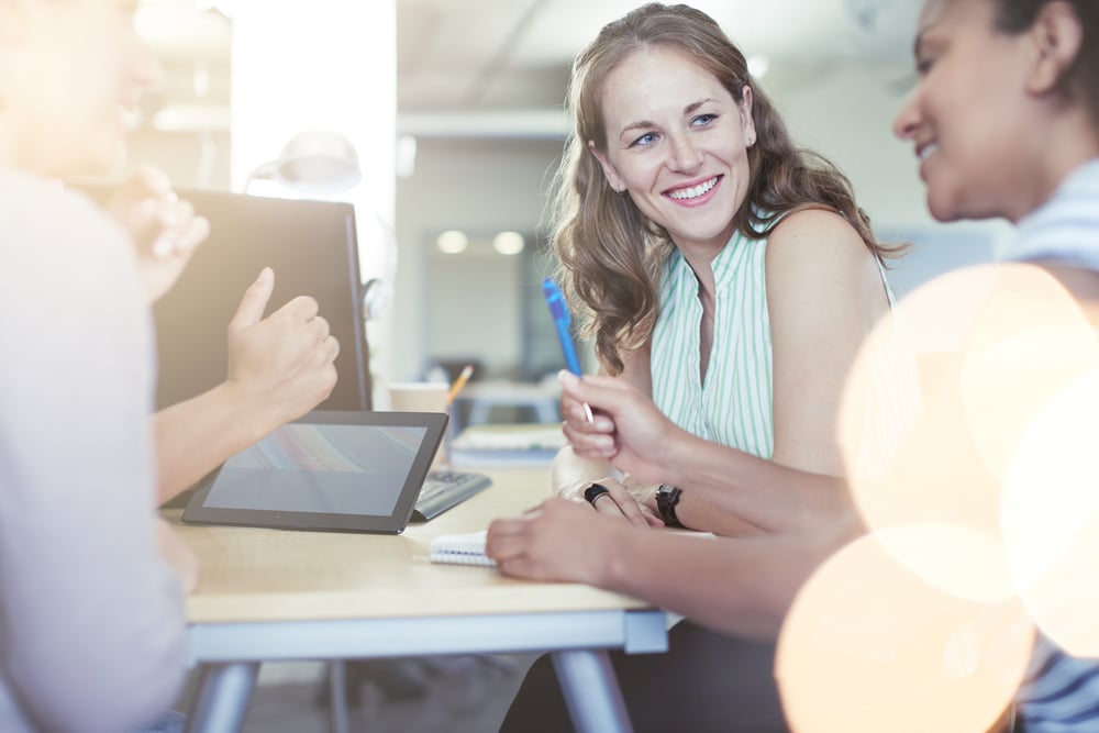 Business people discussion with table and laptop