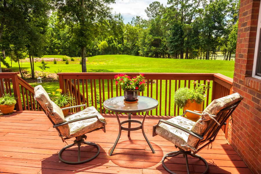 beautiful refinished deck with outdoor furniture