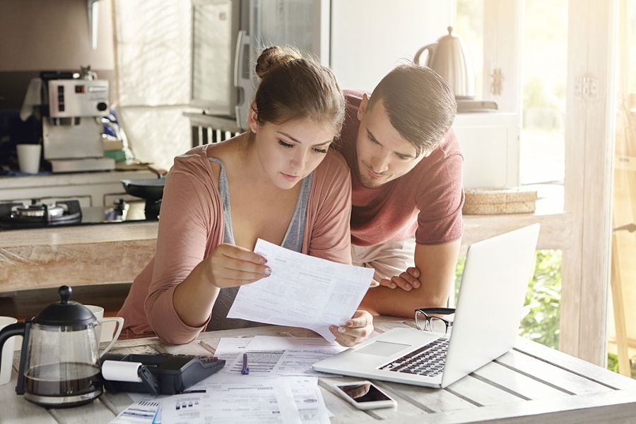 Couple looking at financial paperwork