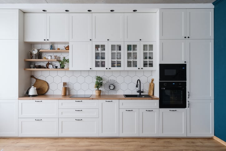 kitchen with white cabinets and open shelving