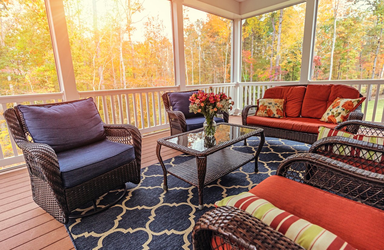 outdoor rug and patio furniture on covered porch