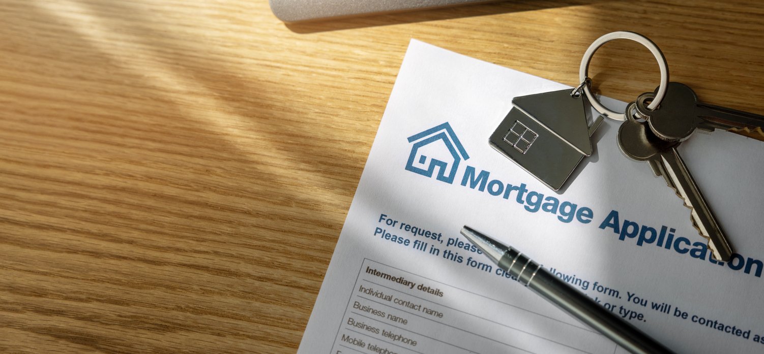 mortgage application with keys and pen