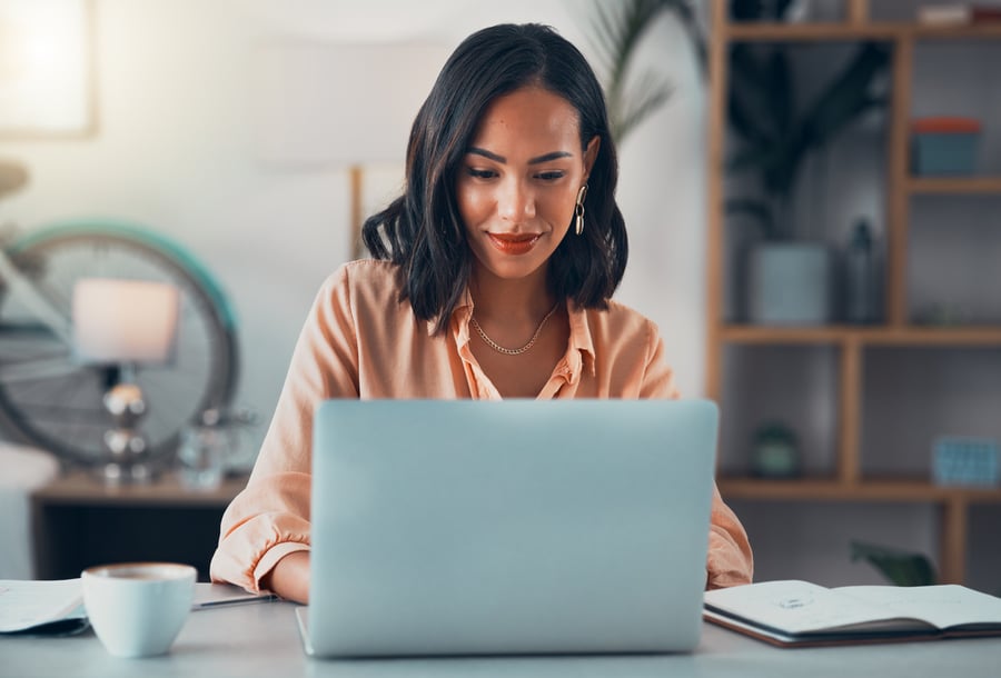 woman typing on laptop