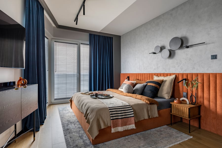 bedroom with orange and blue decor