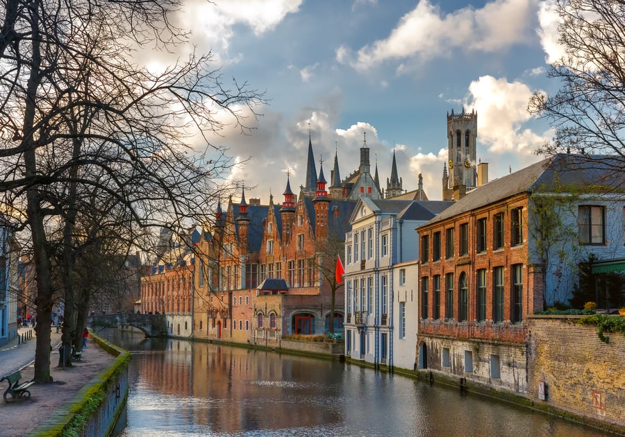 Scenic cityscape with a medieval tower Belfort and the Green canal, Groenerei, in Bruges, Belgium