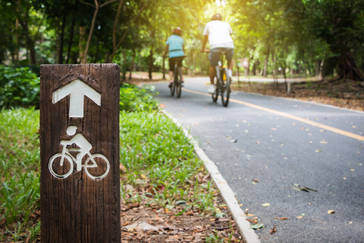 couple riding on bike trail