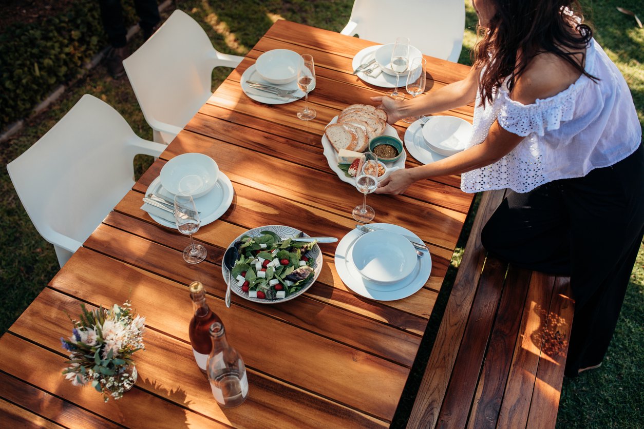 woman setting beautiful outdoor table