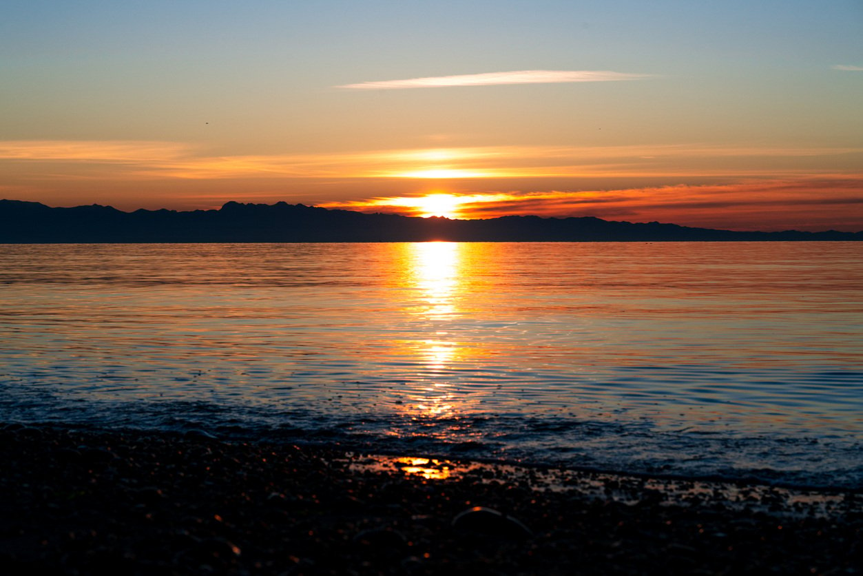 The sun setting over Puget Sound from Whidbey Island in Oak Harbor, WA