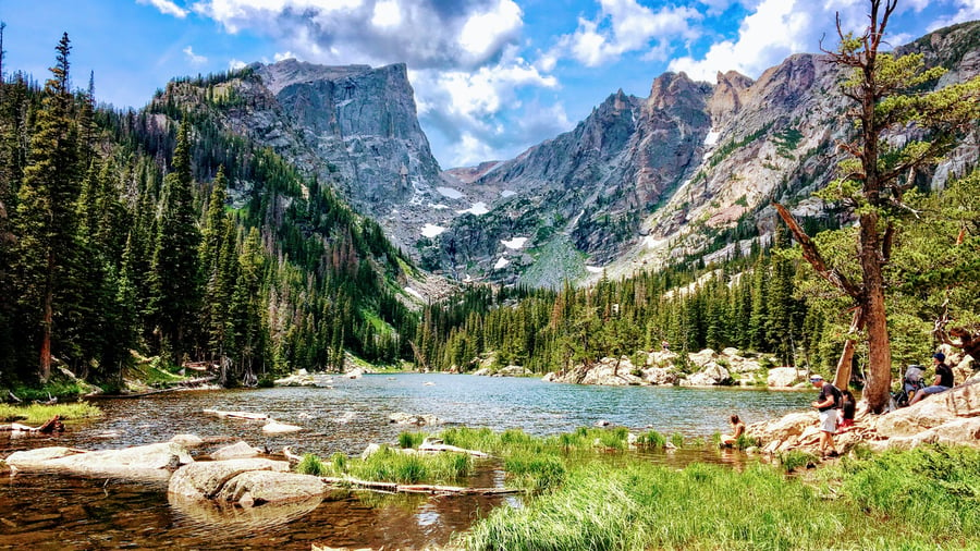 view of beutiful river, mountains, and forest in the Rocky Mountain National Park in Colorado