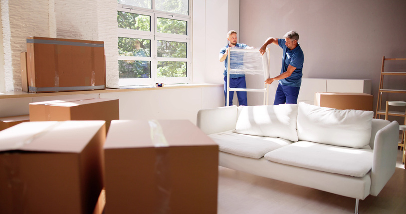 moving wrapping furniture with plastic wrap in living room