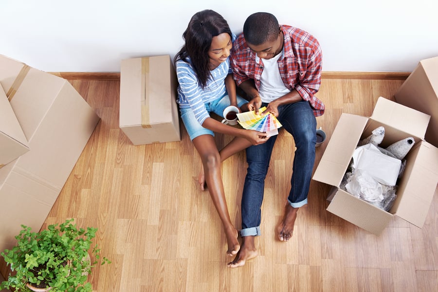 couple looking at paint samples in new home