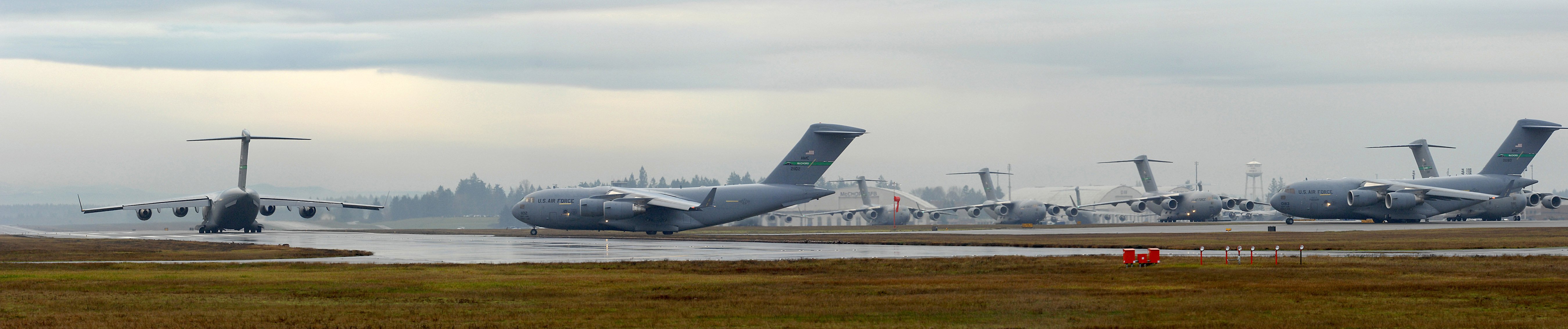 10 Globemaster IIIs fly in formation over Washington state Several C-17 Globemaster III's wait on the flightline prior to launching as part of a 10-ship formation training exercise Dec. 20 at McChord Air Force Base, Wash